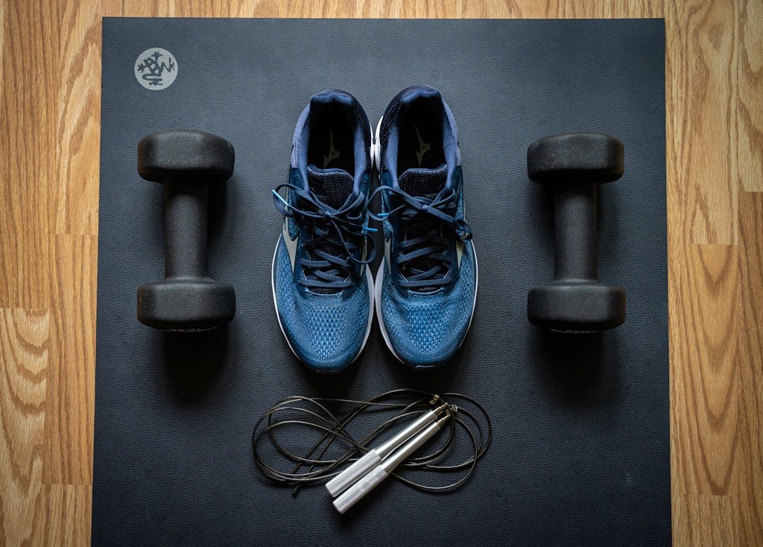 Home Home gym equipment by ProsourceFit dumbbells and Mizuno sneakers