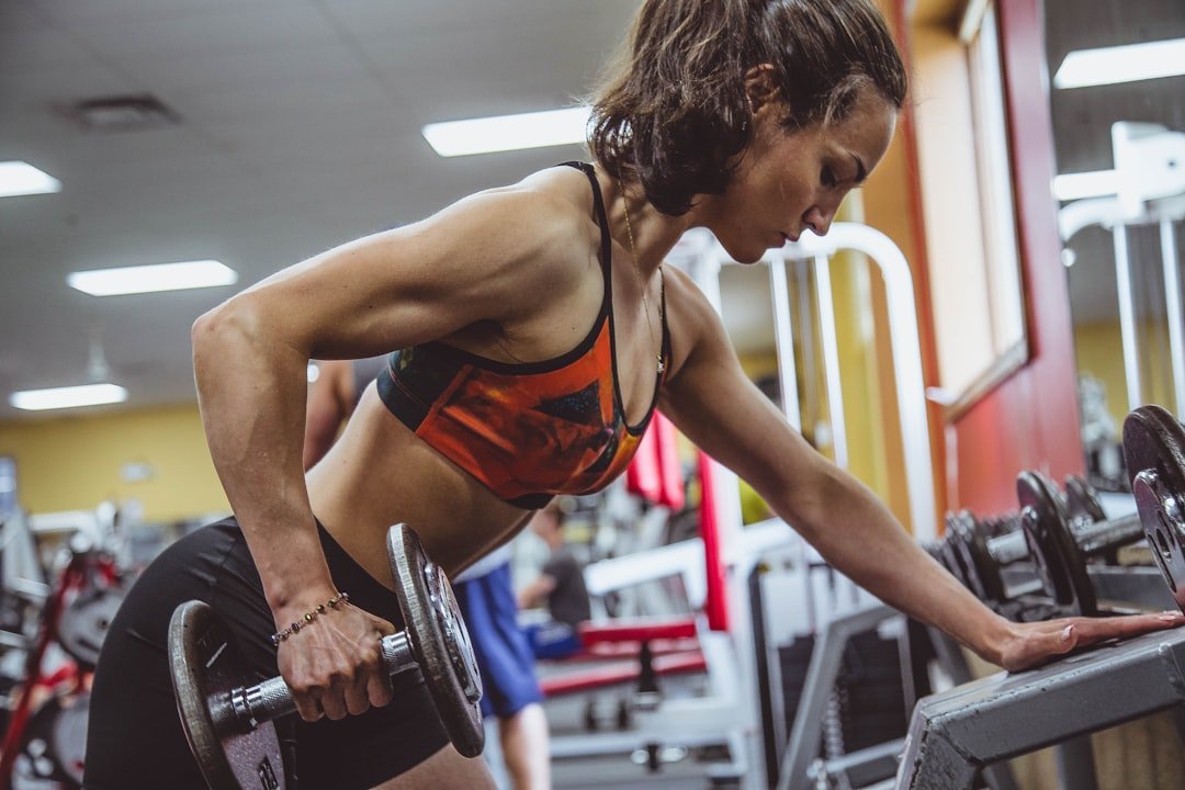 Home woman-seriously-performing-gym-exercise-lonmc8rp1qs